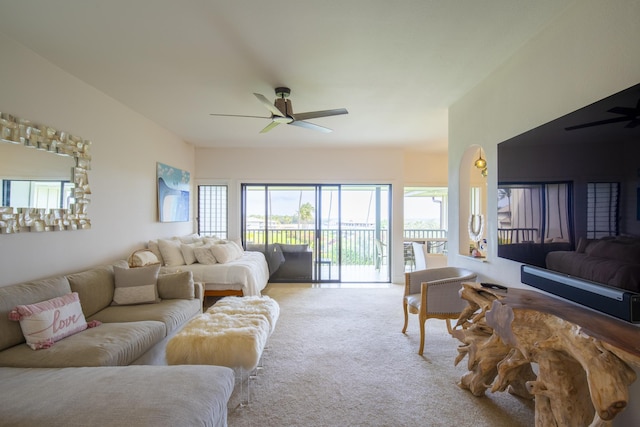 living room with ceiling fan and light colored carpet