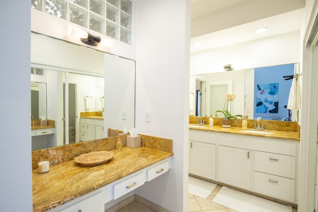 bathroom with tile patterned floors and vanity