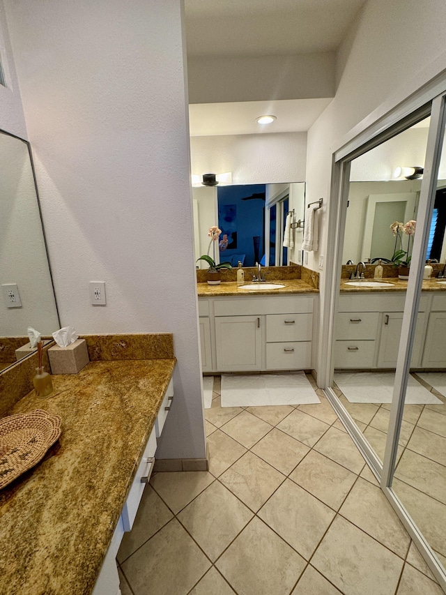 bathroom featuring tile patterned floors and vanity