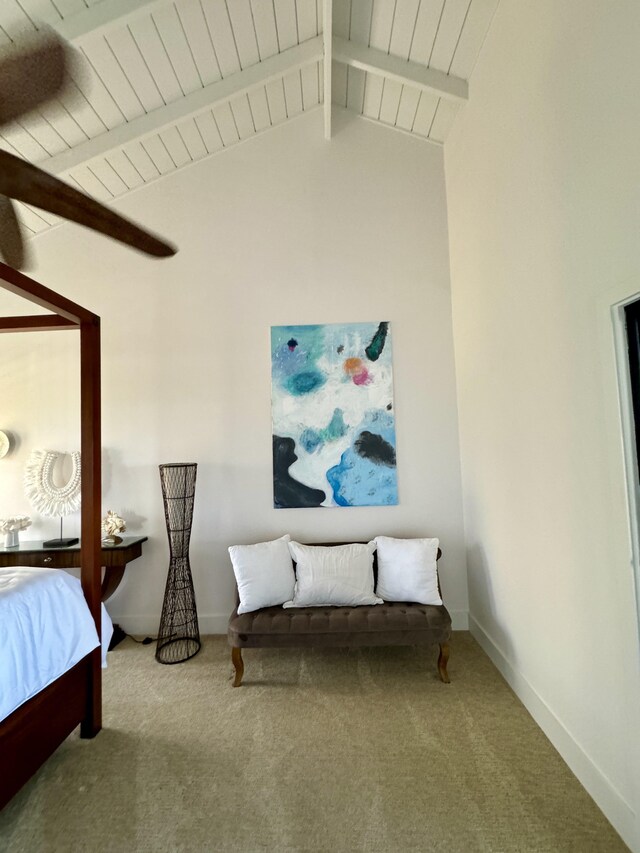 carpeted bedroom with lofted ceiling with beams