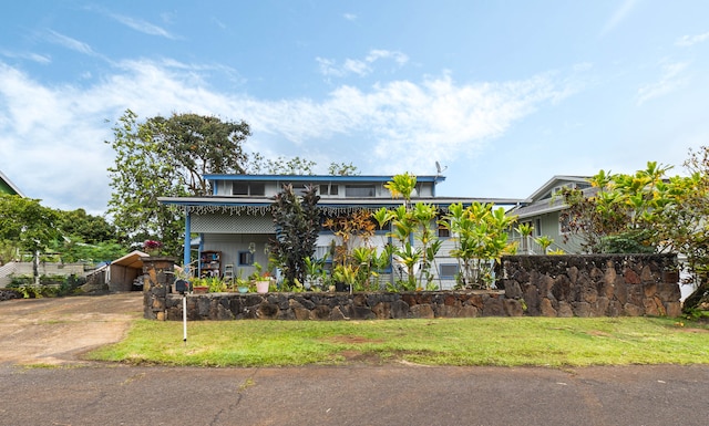 411 Molo St, Kapaa, HI 96746 - view of front of house featuring covered porch and a front yard