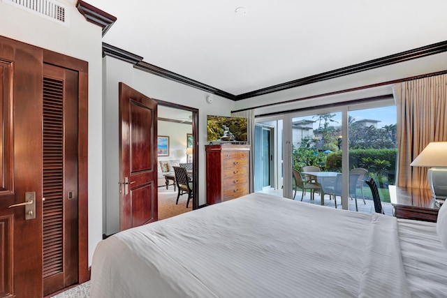 bedroom featuring ornamental molding, carpet flooring, and access to outside