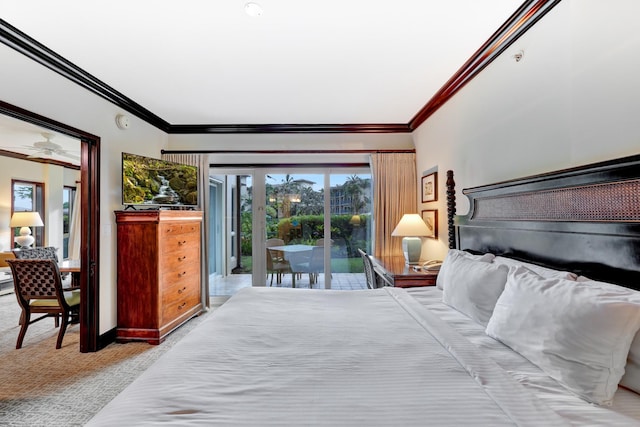 carpeted bedroom featuring ornamental molding and access to exterior