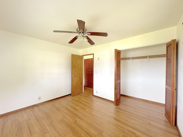 unfurnished bedroom with ceiling fan, light hardwood / wood-style floors, and a closet