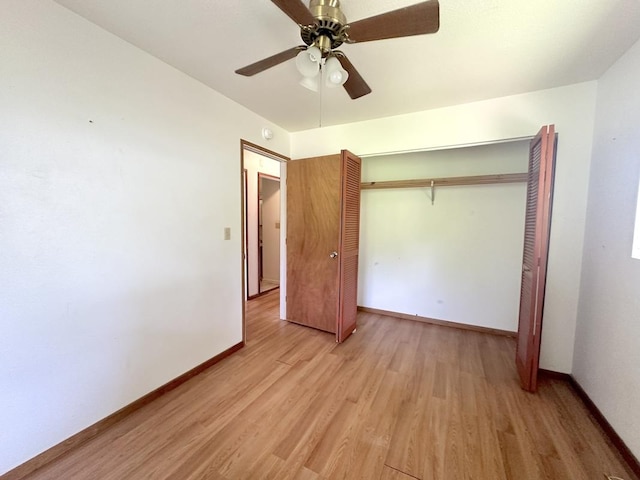 unfurnished bedroom with ceiling fan, a closet, and light hardwood / wood-style floors