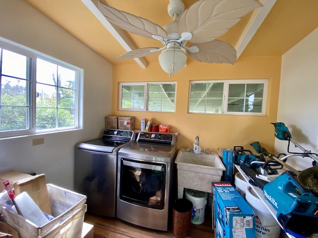 washroom with ceiling fan, wood-type flooring, separate washer and dryer, and sink