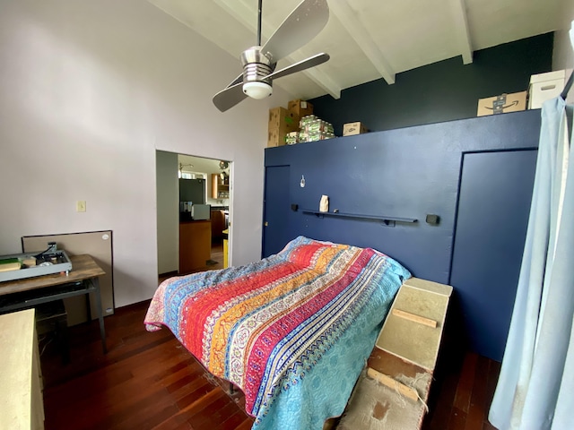 bedroom with beam ceiling, ceiling fan, a high ceiling, and dark hardwood / wood-style floors