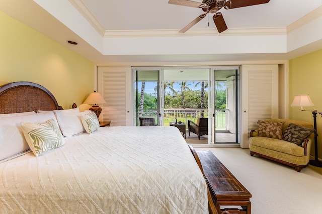 carpeted bedroom with ceiling fan, access to exterior, crown molding, and a raised ceiling