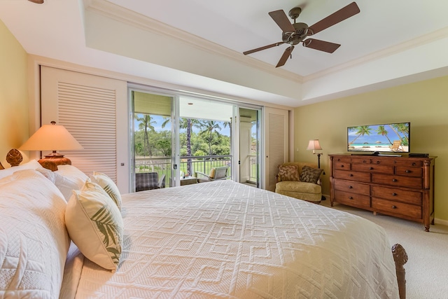 bedroom with ceiling fan, carpet, a raised ceiling, and access to outside