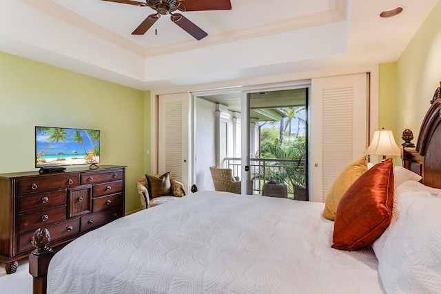 bedroom with access to outside, ceiling fan, ornamental molding, and a raised ceiling