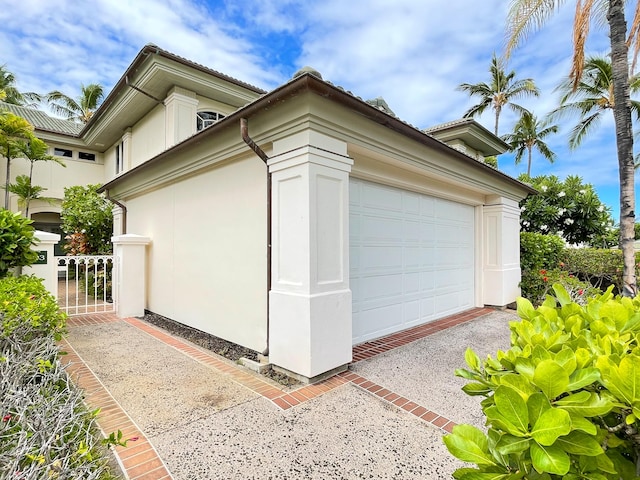 view of side of property with a garage