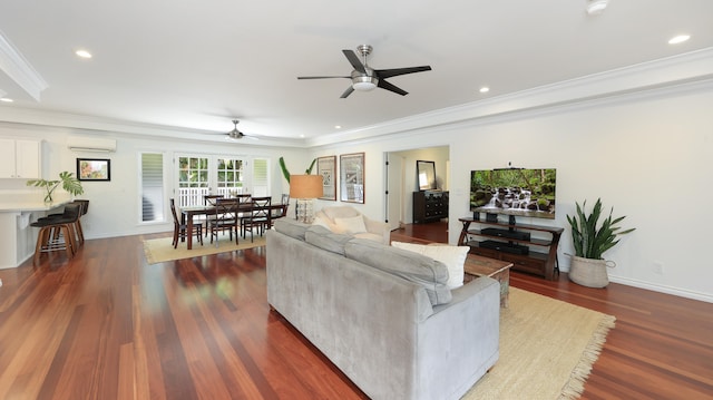 living room featuring a wall mounted air conditioner, dark hardwood / wood-style floors, ceiling fan, and ornamental molding