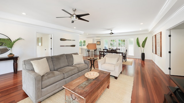 living room with crown molding, hardwood / wood-style flooring, and ceiling fan