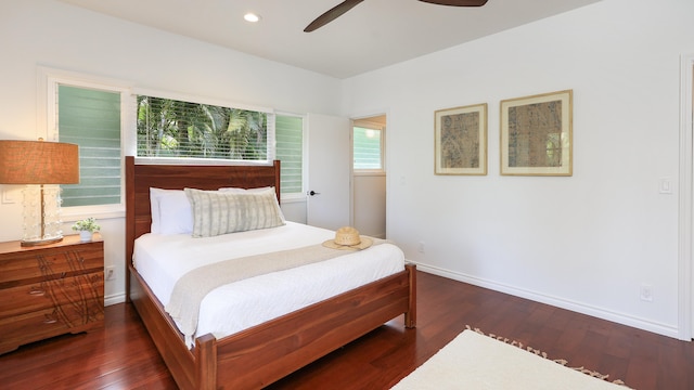 bedroom with ceiling fan and dark wood-type flooring