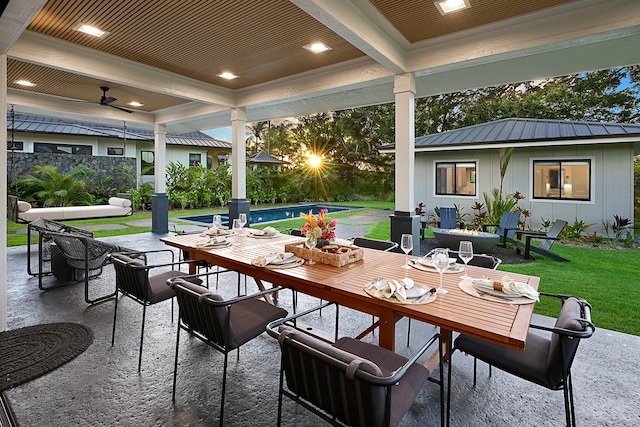 view of patio with a fenced in pool and ceiling fan