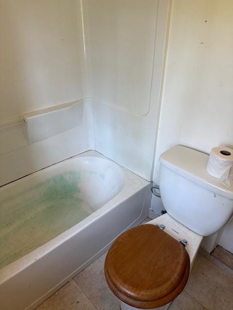 bathroom featuring tile patterned floors and toilet