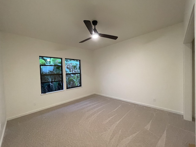 unfurnished room with ceiling fan and carpet floors