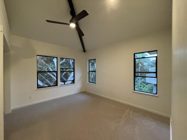 empty room featuring ceiling fan, beam ceiling, carpet floors, and high vaulted ceiling