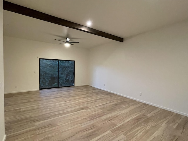 empty room with ceiling fan, light hardwood / wood-style flooring, and beamed ceiling