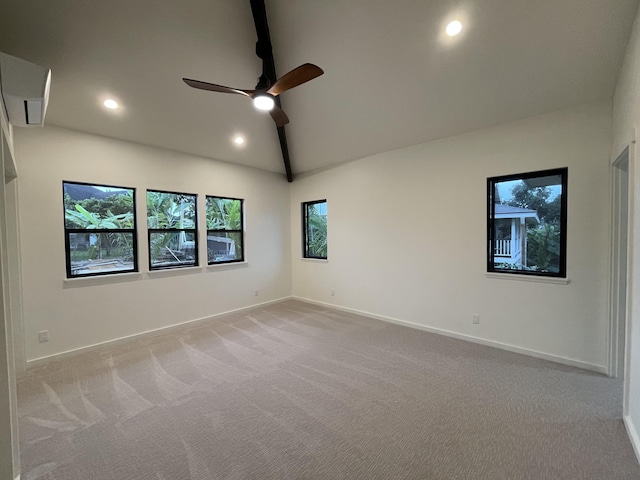 carpeted empty room with ceiling fan and vaulted ceiling