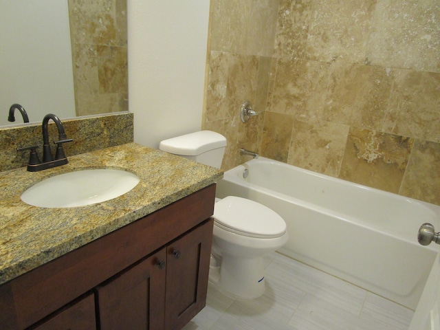 full bathroom with vanity, toilet, and shower / washtub combination