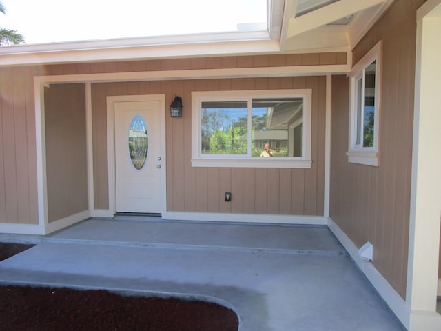 doorway to property featuring covered porch