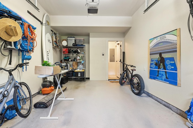 garage with electric panel and a garage door opener