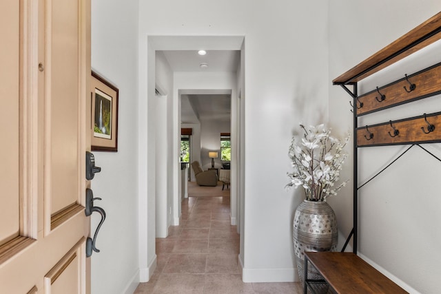 hallway featuring light tile patterned flooring