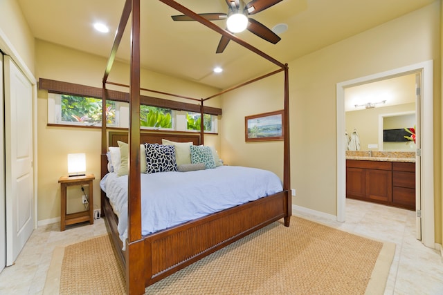 bedroom featuring ceiling fan, a closet, and ensuite bath