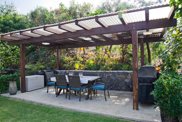 view of patio featuring a pergola and a grill