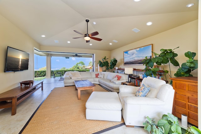 living room featuring vaulted ceiling, ceiling fan, and light tile patterned flooring