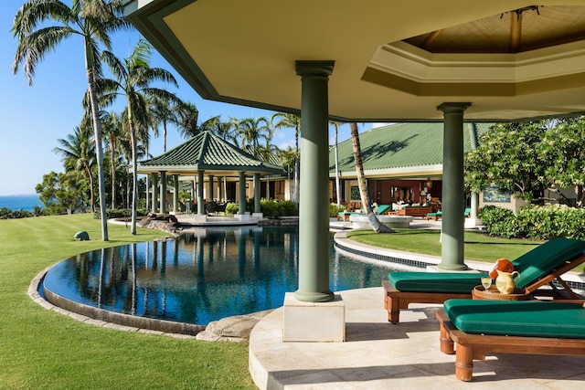 view of swimming pool featuring a gazebo, a yard, and a water view