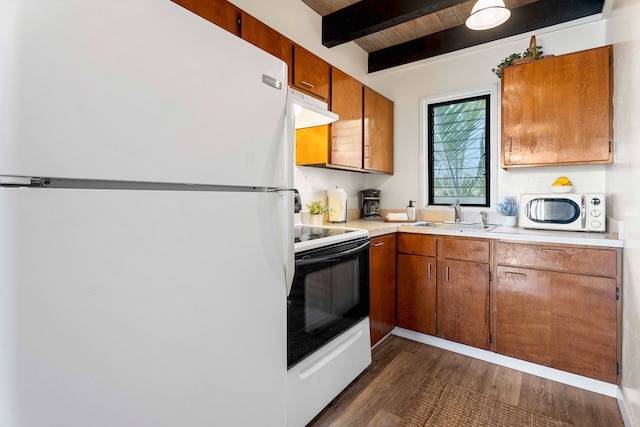 kitchen with white appliances, sink, beam ceiling, wood ceiling, and extractor fan