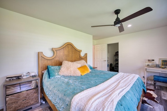 bedroom featuring ceiling fan and dark hardwood / wood-style floors