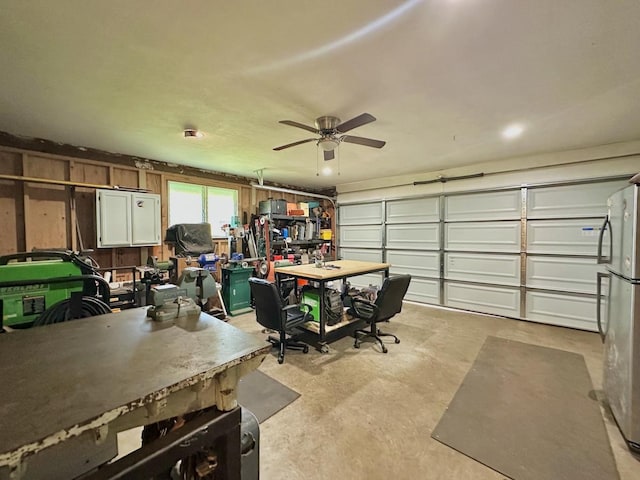 garage featuring ceiling fan and stainless steel fridge