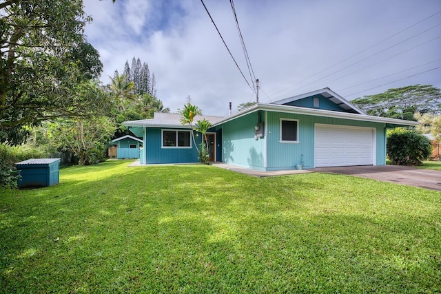 ranch-style home with a front yard and a garage