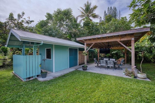 view of yard with an outbuilding and a patio