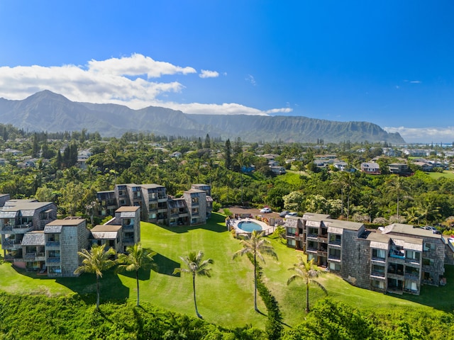 birds eye view of property with a mountain view