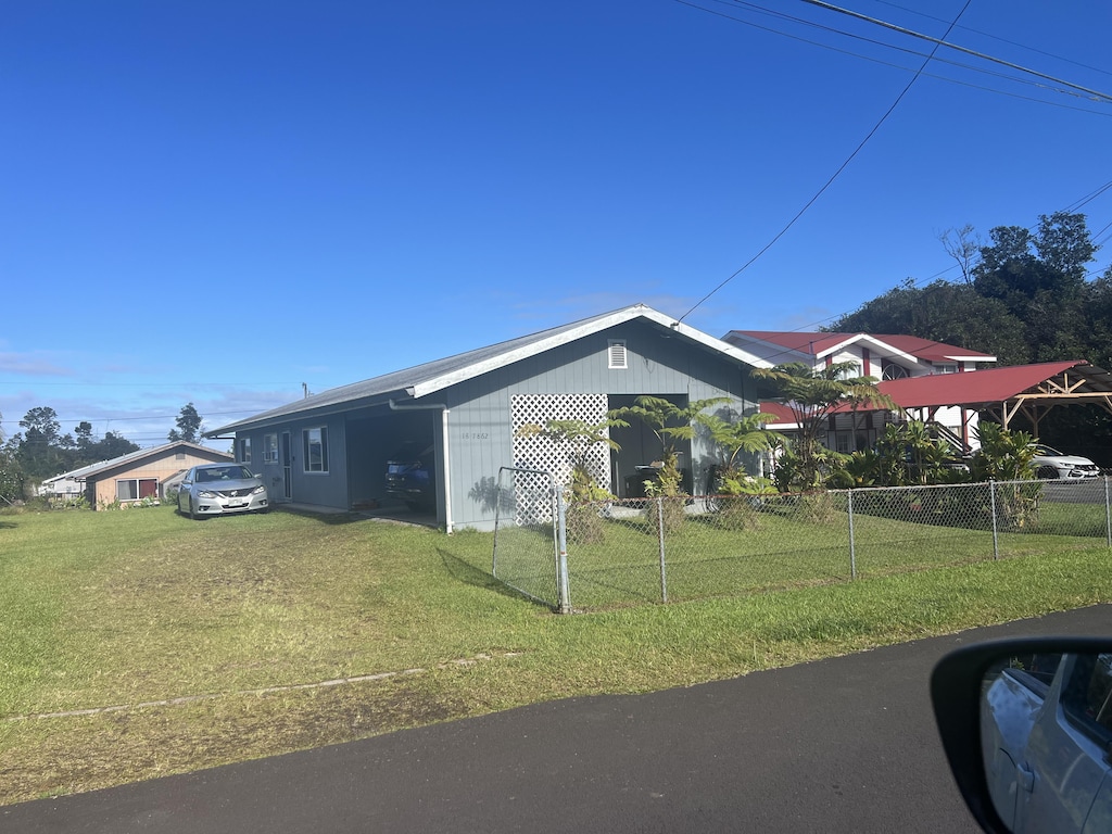 view of home's exterior with a yard