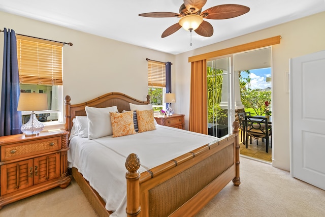 bedroom with ceiling fan, access to exterior, and light carpet