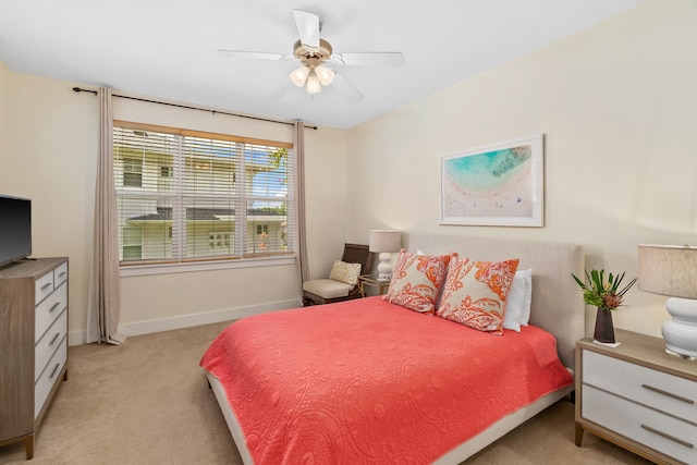 bedroom featuring light carpet and ceiling fan