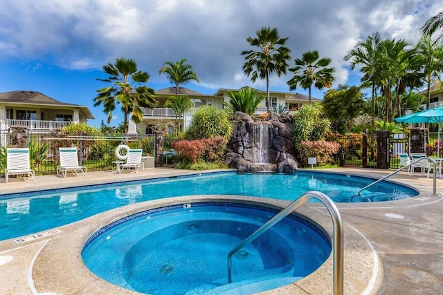 view of swimming pool with a community hot tub