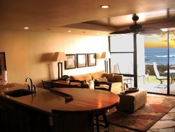 interior space featuring ceiling fan and sink