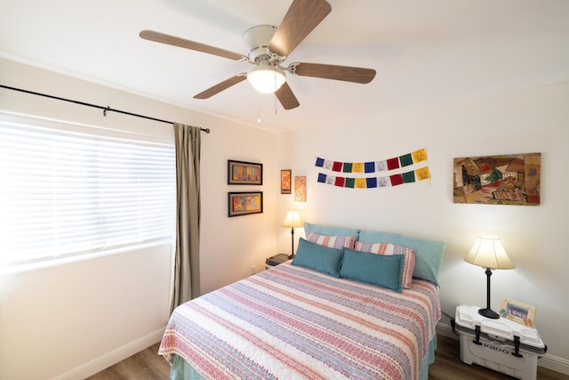 bedroom featuring wood-type flooring and ceiling fan