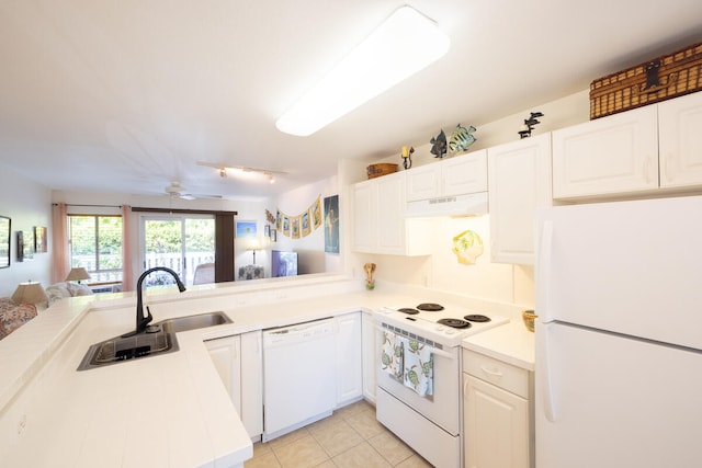 kitchen with white cabinets, light tile patterned floors, white appliances, and ceiling fan