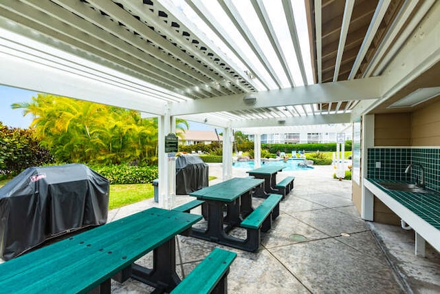 view of patio with a grill