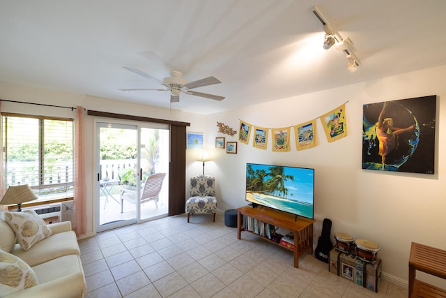 tiled living room featuring ceiling fan and track lighting