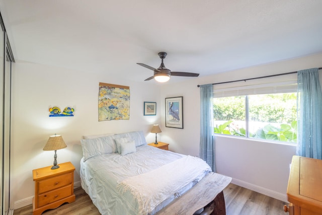 bedroom with ceiling fan and light hardwood / wood-style flooring