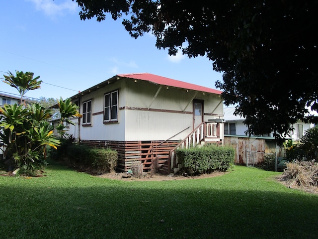 back of house featuring a yard