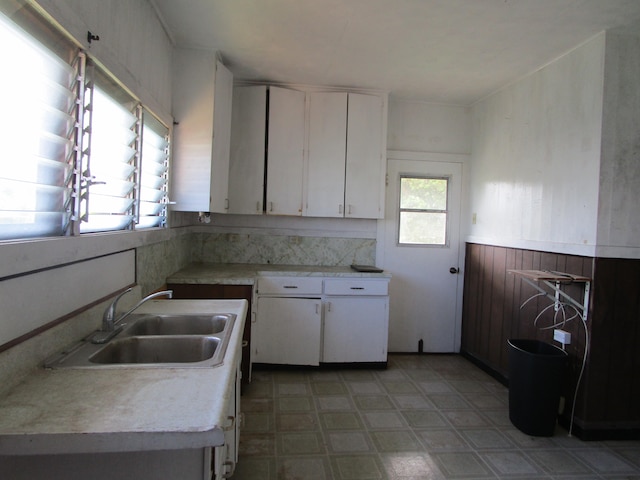 kitchen featuring white cabinetry and sink